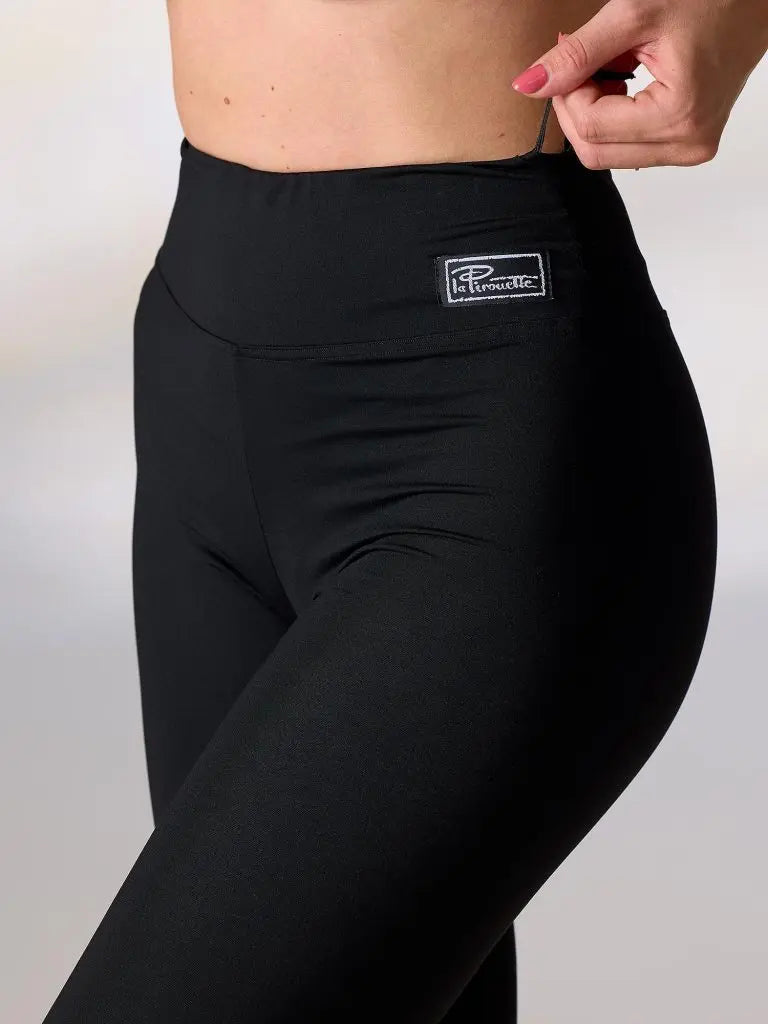 Black leggings with a brand logo on a plain background